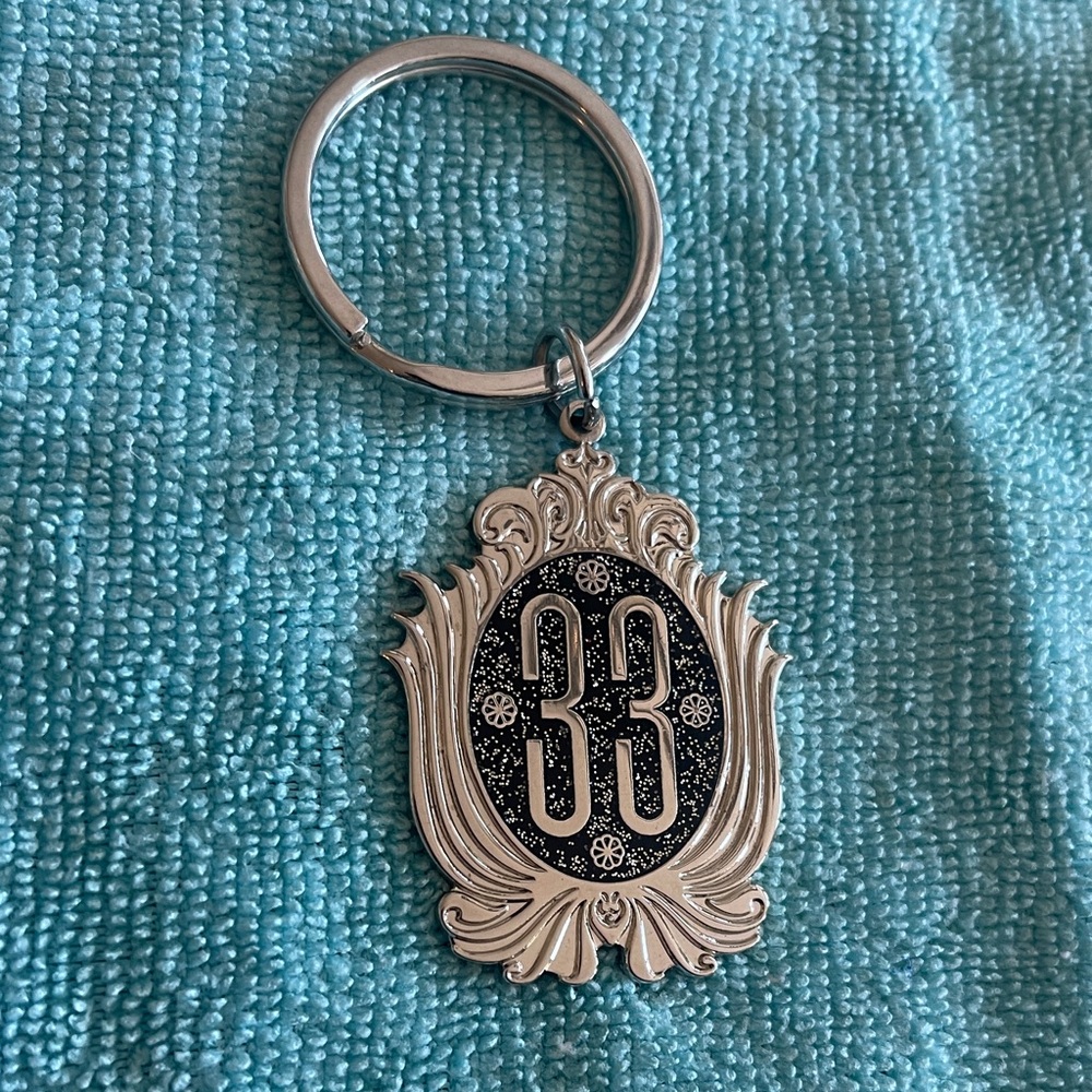 Disney Silver Keychain with Intricate Disney Club 33 design
